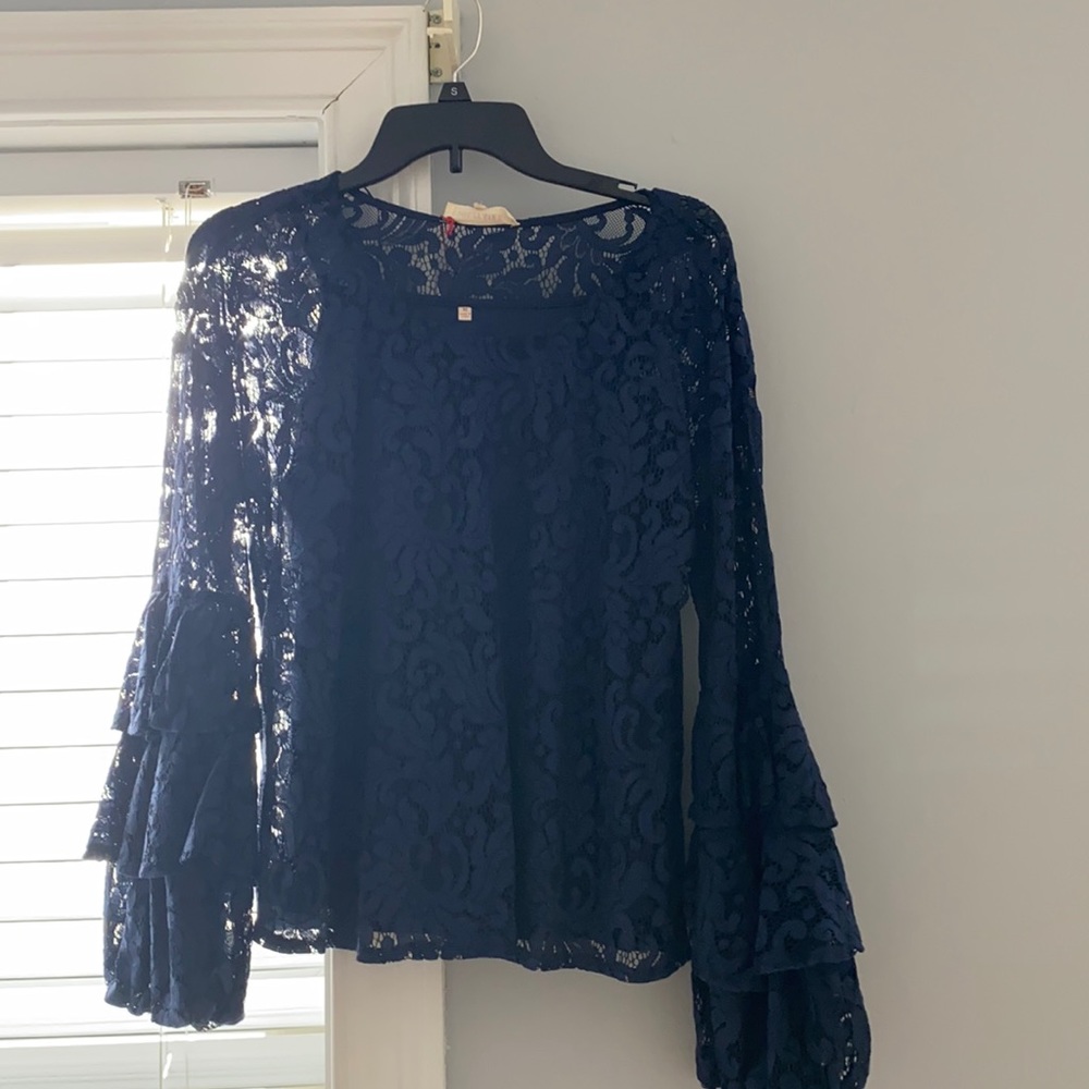 Navy blue lace top with flared ruffle sleeves
